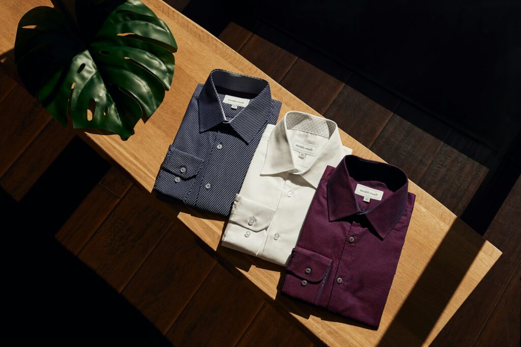 white button up shirt on brown wooden table